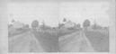 SA0430 - Identified on the back by Sophia Helfrich. Photo shows a dirt road, split rail fence, and buildings. An East Family connection.